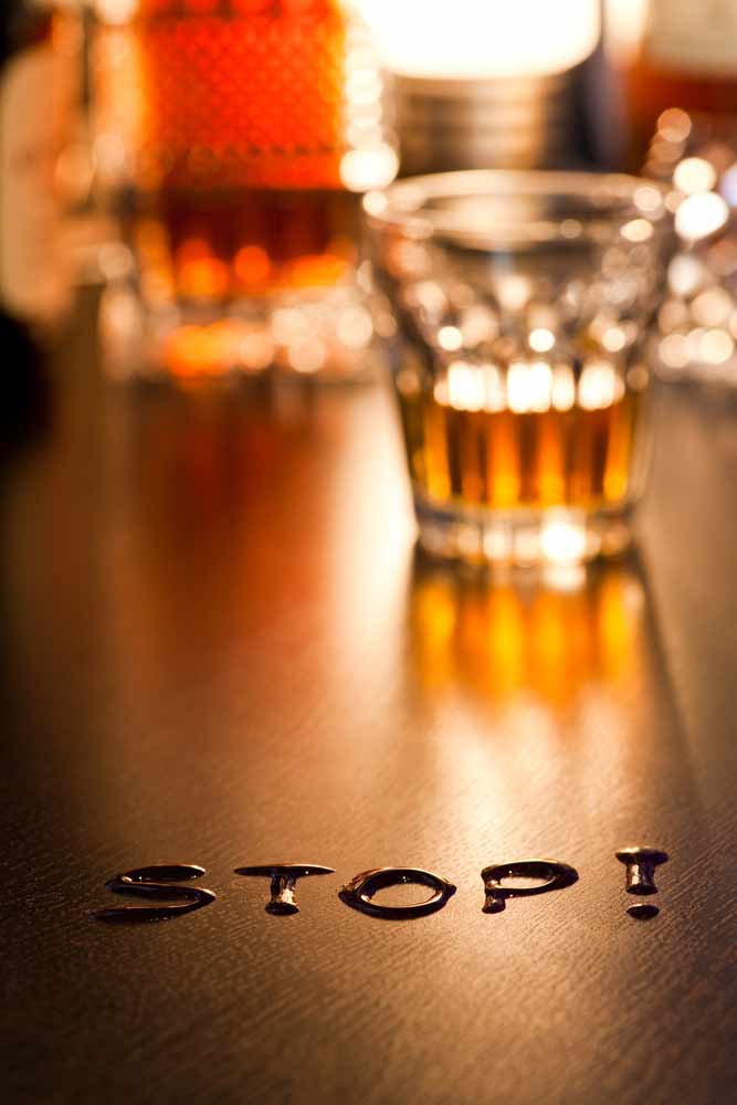 "Stop!" written in beer