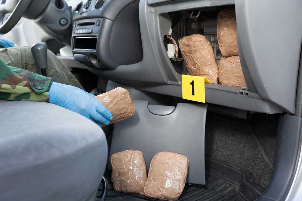 A car filled with hidden drugs being searched