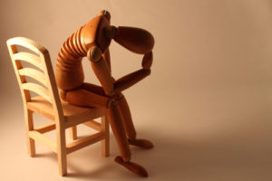 Depressed manakin in a chair