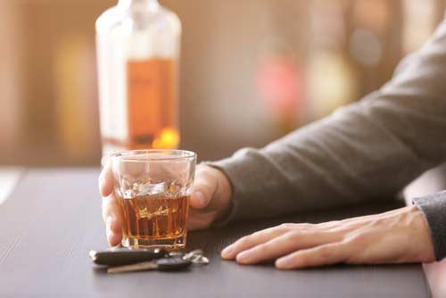 Man drinking at a bar