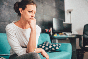 Stressed woman biting her nails