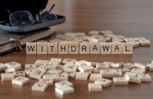 "Withdrawal" written in scrabble letters