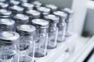 Clear vials in a rack.