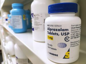 Alprazolam in a white bottle on a shelf