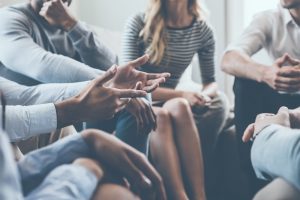 A circle of people in group therapy