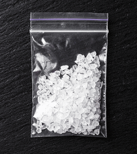 White, crystalline drugs in a plastic bag