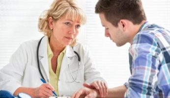 A nurse or doctor consoling a patient