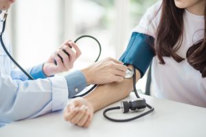 Person getting their blood pressure checked