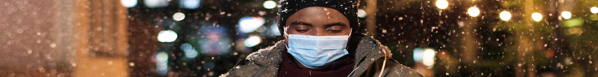 sad-man-outside-with-mask-on-during-quarantine-holiday-season